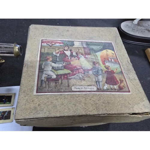435 - A rare early 20th century German tin plate magic lantern bearing D.R.G.M registration mark, the lant... 