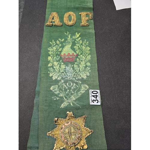 455 - A senior officers ceremonial sash of ribbed green moire silk prominently applied with genuine gold b... 