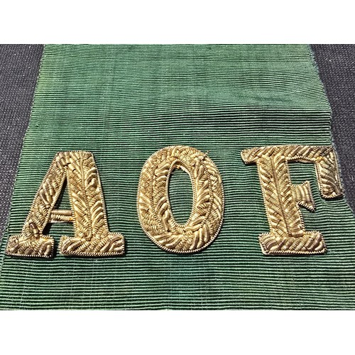 455 - A senior officers ceremonial sash of ribbed green moire silk prominently applied with genuine gold b... 