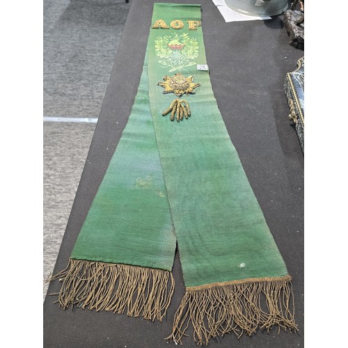455 - A senior officers ceremonial sash of ribbed green moire silk prominently applied with genuine gold b... 