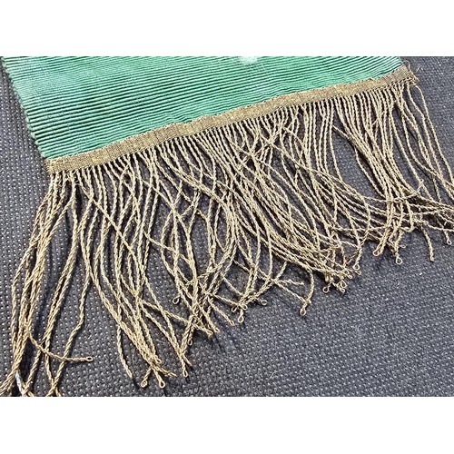 455 - A senior officers ceremonial sash of ribbed green moire silk prominently applied with genuine gold b... 