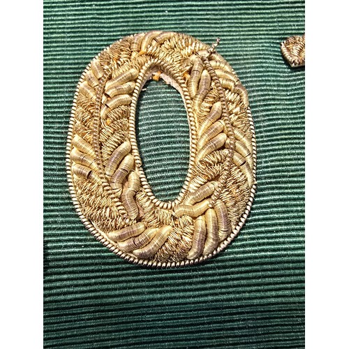 455 - A senior officers ceremonial sash of ribbed green moire silk prominently applied with genuine gold b... 