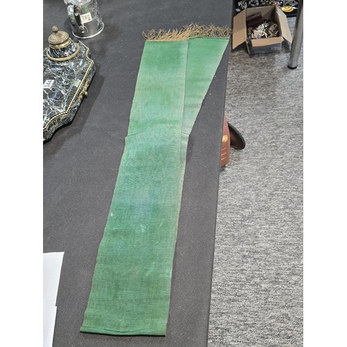 455 - A senior officers ceremonial sash of ribbed green moire silk prominently applied with genuine gold b... 