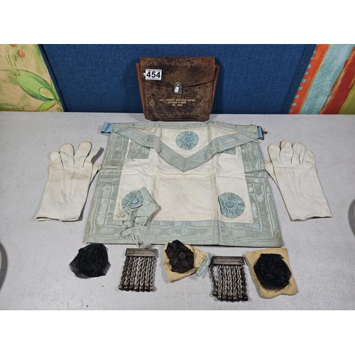 454 - A collection of good vintage Masonic related items to include a Masonic apron, 2x Masonic metal tass... 