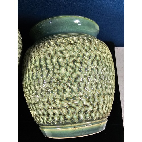 457 - 2 good large Denby bracken pattern vases having a textured design, both are in a green matching glaz... 