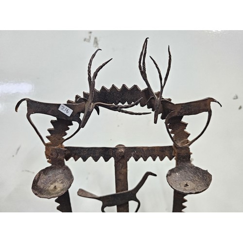 444 - An impressive antique large Indian tribal wrought iron oil lamp or diwali light stand, late 19th/ ea... 