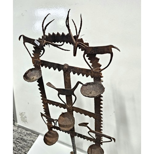 444 - An impressive antique large Indian tribal wrought iron oil lamp or diwali light stand, late 19th/ ea... 