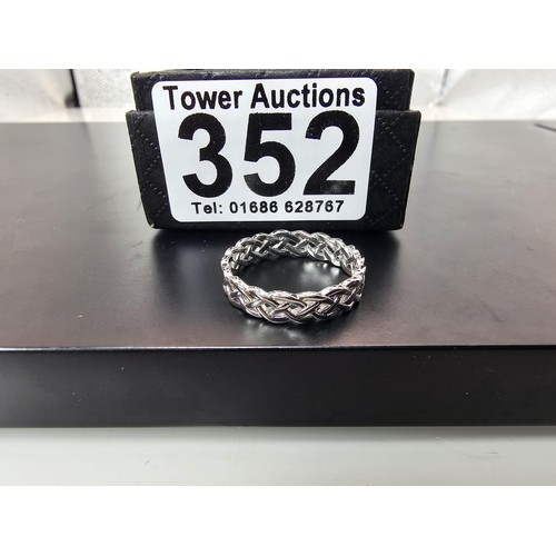 352 - A brand new 925 Silver ring having a Celtic Knot pierced design all the way around. The ring is size... 