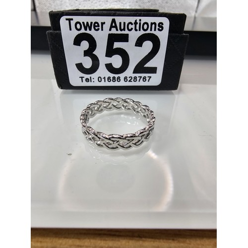 352 - A brand new 925 Silver ring having a Celtic Knot pierced design all the way around. The ring is size... 