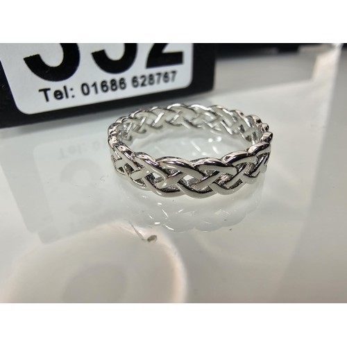 352 - A brand new 925 Silver ring having a Celtic Knot pierced design all the way around. The ring is size... 