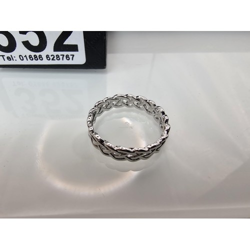 352 - A brand new 925 Silver ring having a Celtic Knot pierced design all the way around. The ring is size... 