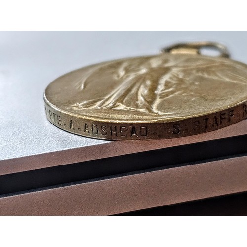 256 - A quantity of collectable badges to include 2x brass Institute Staff War Department identity tags da... 