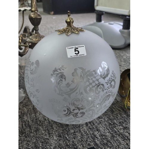 5 - A three tier ceiling chandelier with a brushed brass design with three fluted opaque glass shades an... 