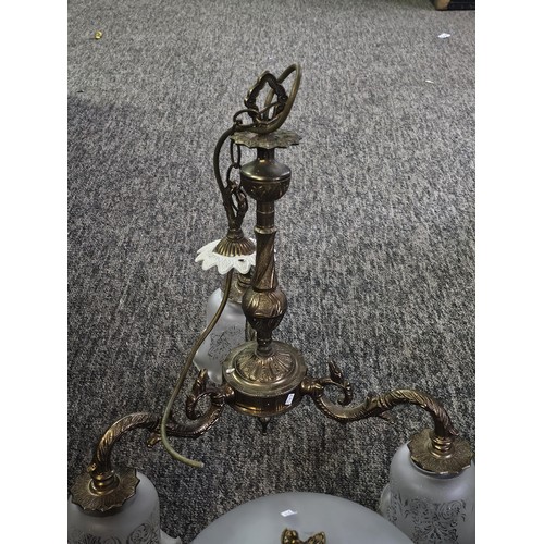 5 - A three tier ceiling chandelier with a brushed brass design with three fluted opaque glass shades an... 