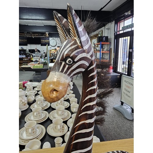 8 - A collection of three graduated wooden zebra's figures in a comical design. One of the zebra's has a... 
