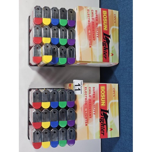11 - Two boxed as new Bosum lighters, 15 in each packet. All lighters are oversized with diced decoration... 
