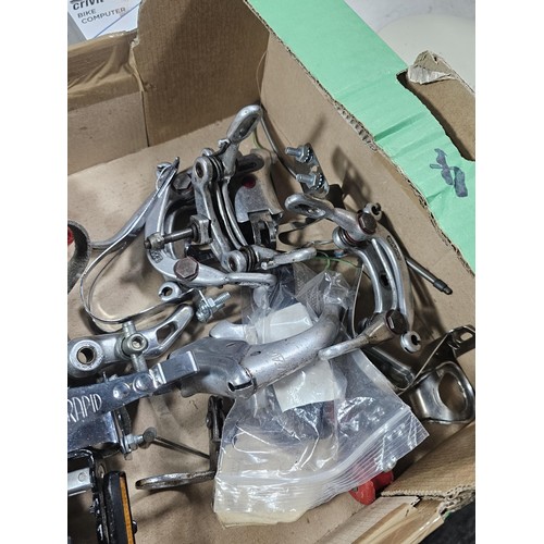 13 - A box containing a quantity of cycling accessories to include slime smart tubes, a rechargeable fron... 