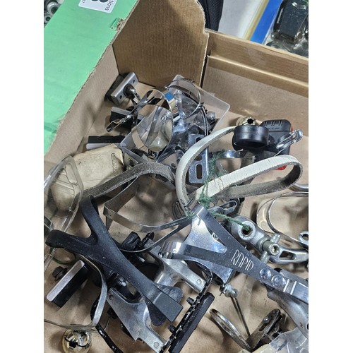 13 - A box containing a quantity of cycling accessories to include slime smart tubes, a rechargeable fron... 