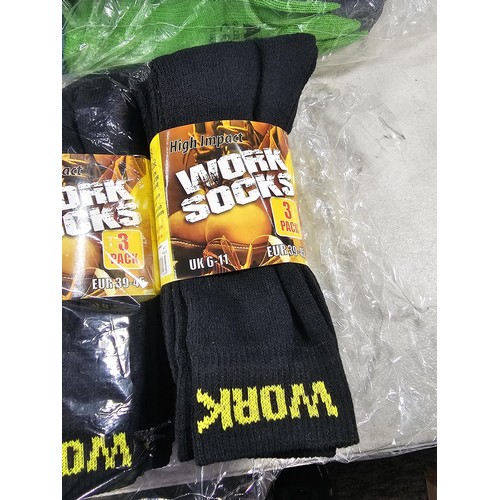 15 - A large quantity of new and sealed Asda work gloves along with twelve pairs of work socks.