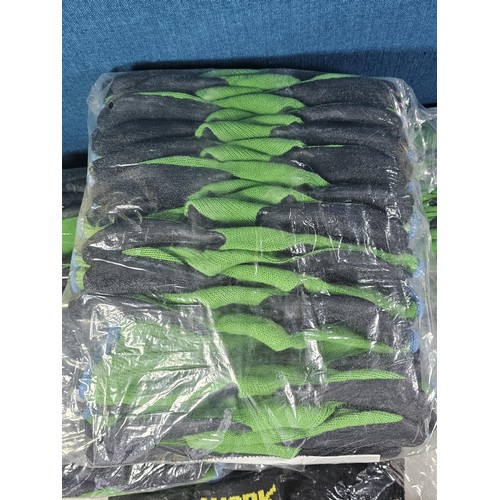 15 - A large quantity of new and sealed Asda work gloves along with twelve pairs of work socks.