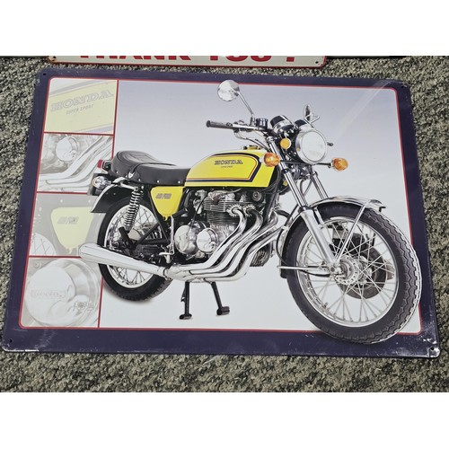 28 - A collection of four tin plate signs to include a Honda motorbike, a fishing comical sign, a kitchen... 