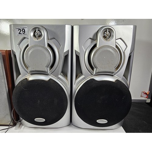 29 - A pair Sony table top speakers with a wood veneer along with a pair of unbranded speakers