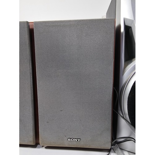 29 - A pair Sony table top speakers with a wood veneer along with a pair of unbranded speakers