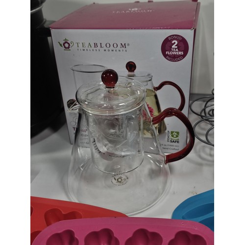 38 - Box containing a boxed Tea Bloom teapot along with a crock pot with glass lid, jelly moulds plastic ... 