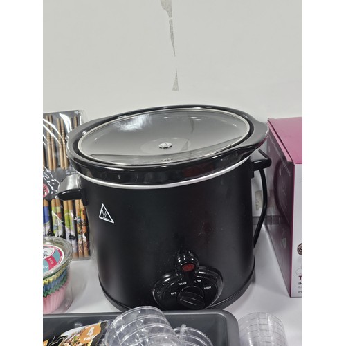 38 - Box containing a boxed Tea Bloom teapot along with a crock pot with glass lid, jelly moulds plastic ... 
