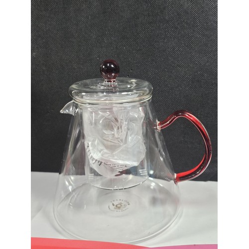 38 - Box containing a boxed Tea Bloom teapot along with a crock pot with glass lid, jelly moulds plastic ... 