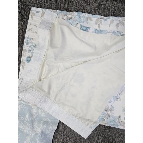 39 - A collection of 3x pairs of Laura Ashley curtains to include a blue dog pattern pair, a light blue p... 