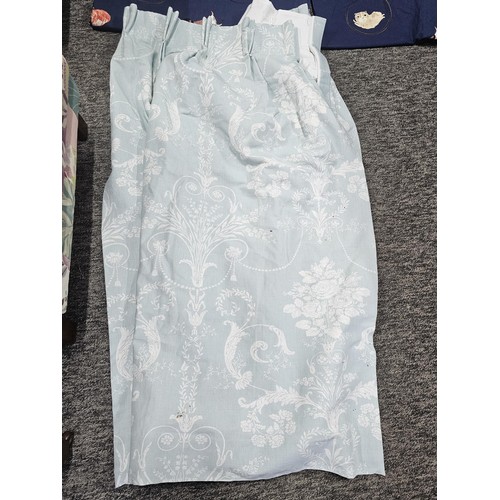 39 - A collection of 3x pairs of Laura Ashley curtains to include a blue dog pattern pair, a light blue p... 