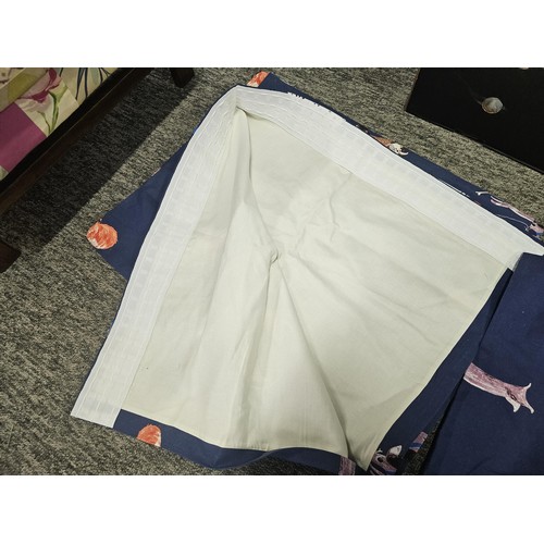 39 - A collection of 3x pairs of Laura Ashley curtains to include a blue dog pattern pair, a light blue p... 