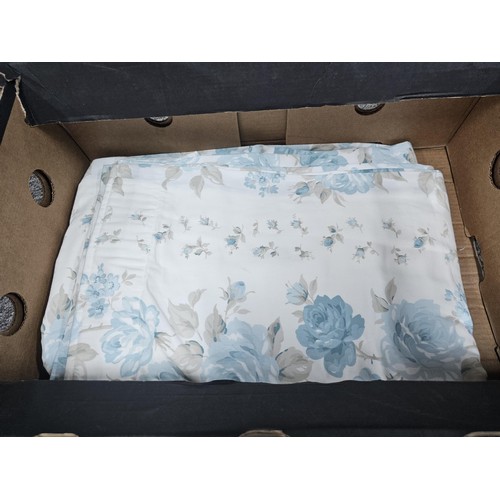 39 - A collection of 3x pairs of Laura Ashley curtains to include a blue dog pattern pair, a light blue p... 