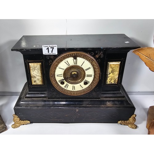 17 - A slate clock with enamelled dial standing on gilded feet. The clock is in need of attention along w... 