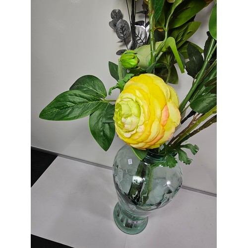 21 - A good quality glass vase with firing imperfections containing a quantity of artificial flowers. alo... 