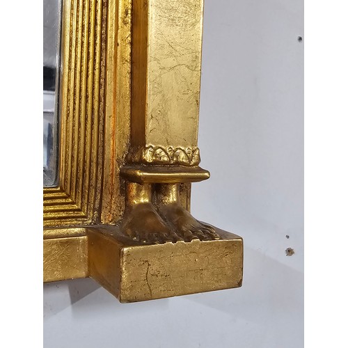 54 - A large ornate gilded triple over mantle bevel edged mirror with a Egyptian frieze to the top, a pha... 