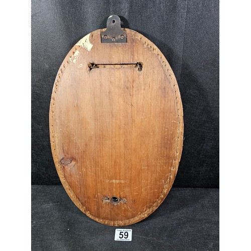 59 - A good quality antique oval shaped bevel shaped mirror with fluting to the edge of the mirror, the m... 