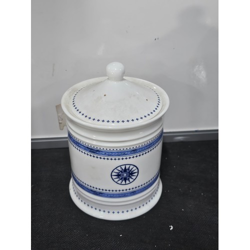 62 - Shelf full of collectables to include a very large trumpet vase in deep red along with 3x matching b... 