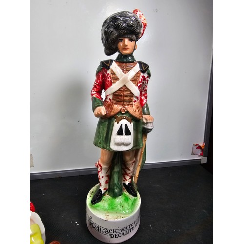 64 - Collection of 9x vintage character decanters with musical bases to include a Scotsman on a lamp post... 