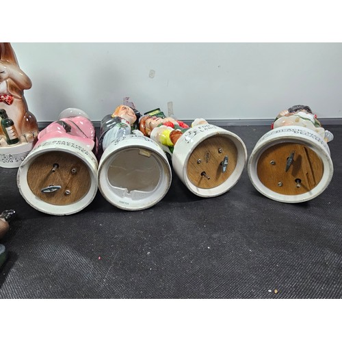 64 - Collection of 9x vintage character decanters with musical bases to include a Scotsman on a lamp post... 