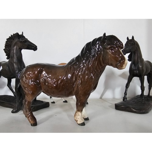 65 - A collection of ceramic horse figures to include a Beswick Sheltand pony and foal, the foal has chip... 