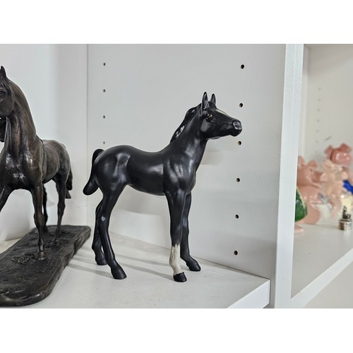 65 - A collection of ceramic horse figures to include a Beswick Sheltand pony and foal, the foal has chip... 