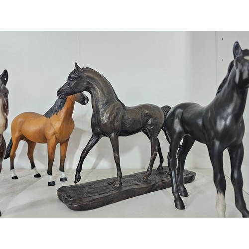 65 - A collection of ceramic horse figures to include a Beswick Sheltand pony and foal, the foal has chip... 