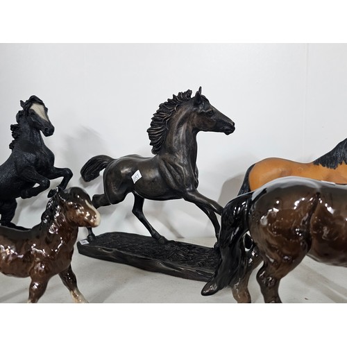 65 - A collection of ceramic horse figures to include a Beswick Sheltand pony and foal, the foal has chip... 