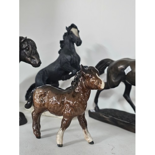 65 - A collection of ceramic horse figures to include a Beswick Sheltand pony and foal, the foal has chip... 