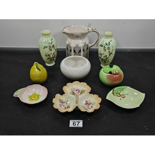 67 - A shelf of collectable to include a good quality liberty art deco style jug, a pair of hand painted ... 