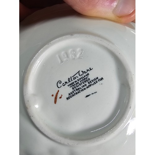 67 - A shelf of collectable to include a good quality liberty art deco style jug, a pair of hand painted ... 