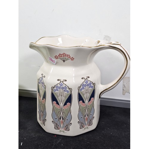 67 - A shelf of collectable to include a good quality liberty art deco style jug, a pair of hand painted ... 