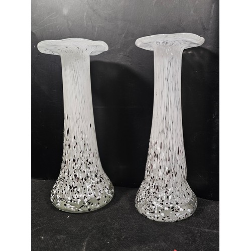 68 - A small quantity of collectable glassware to include two white and black spotted candle holders with... 